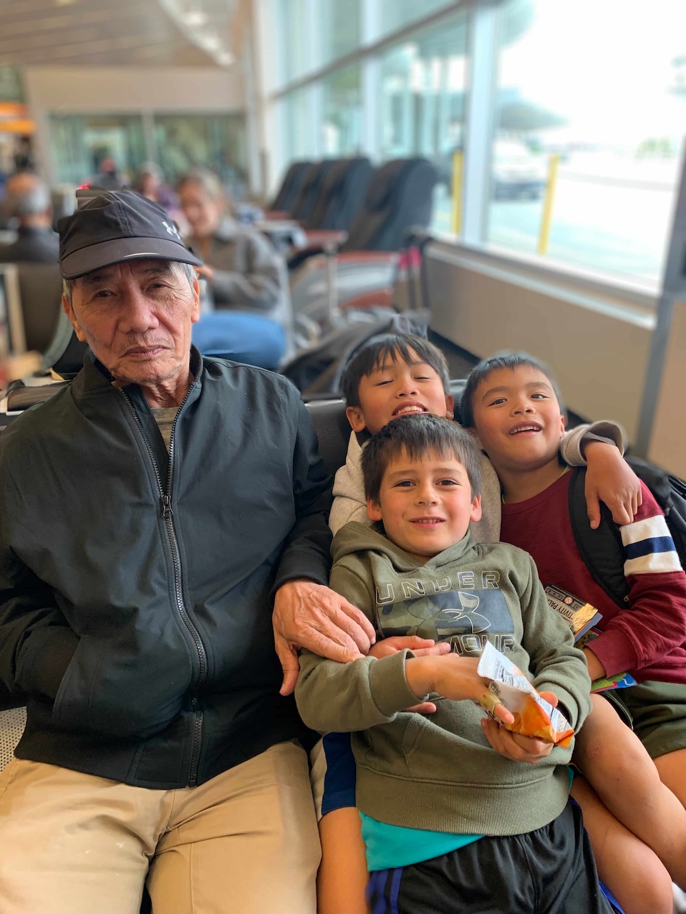 Grandfather sitting with his grandchildren
